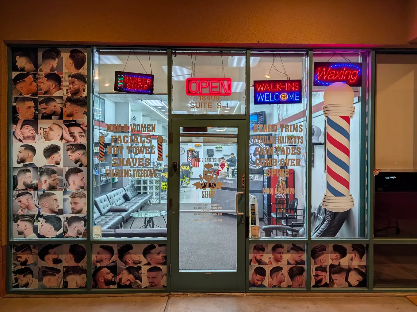 Storefront of Kings K Barbershop with an open sign, a walk-ins sign, and a barber pole