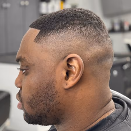 High Skin Fade Buzz Cut & Razor Lineup - Clean high bald fade on close buzz cut with straight razor forehead lineup and sideburn graduation.